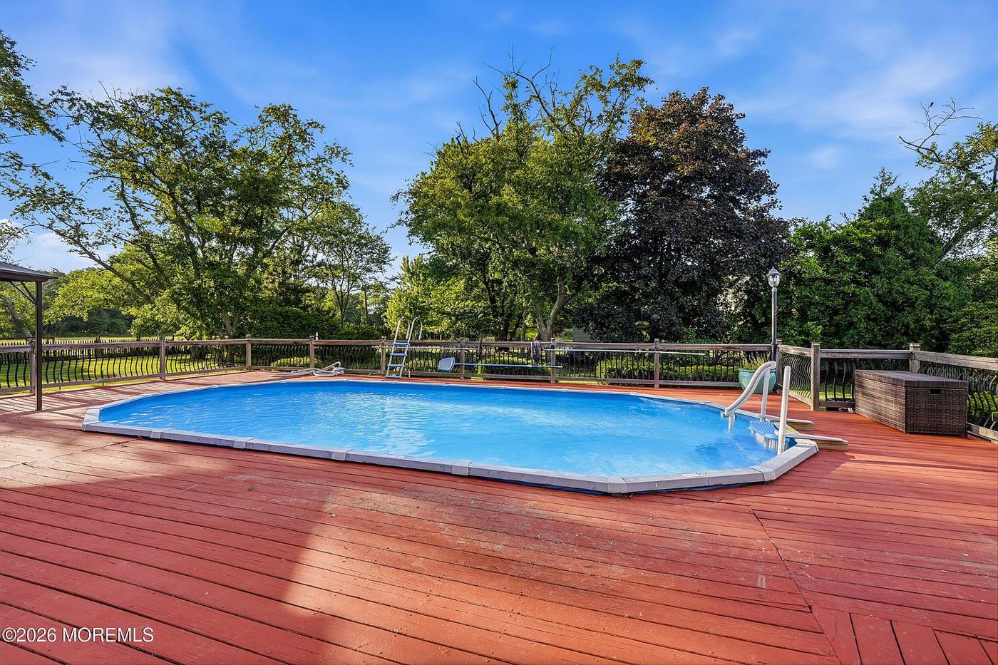 Pool surrounded by a large deck