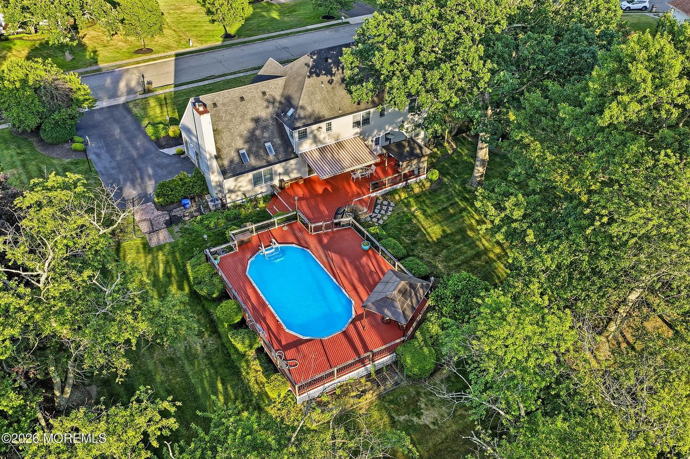 Aerial view of the house, pool and acre lot